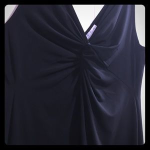 Black dress. Knee level